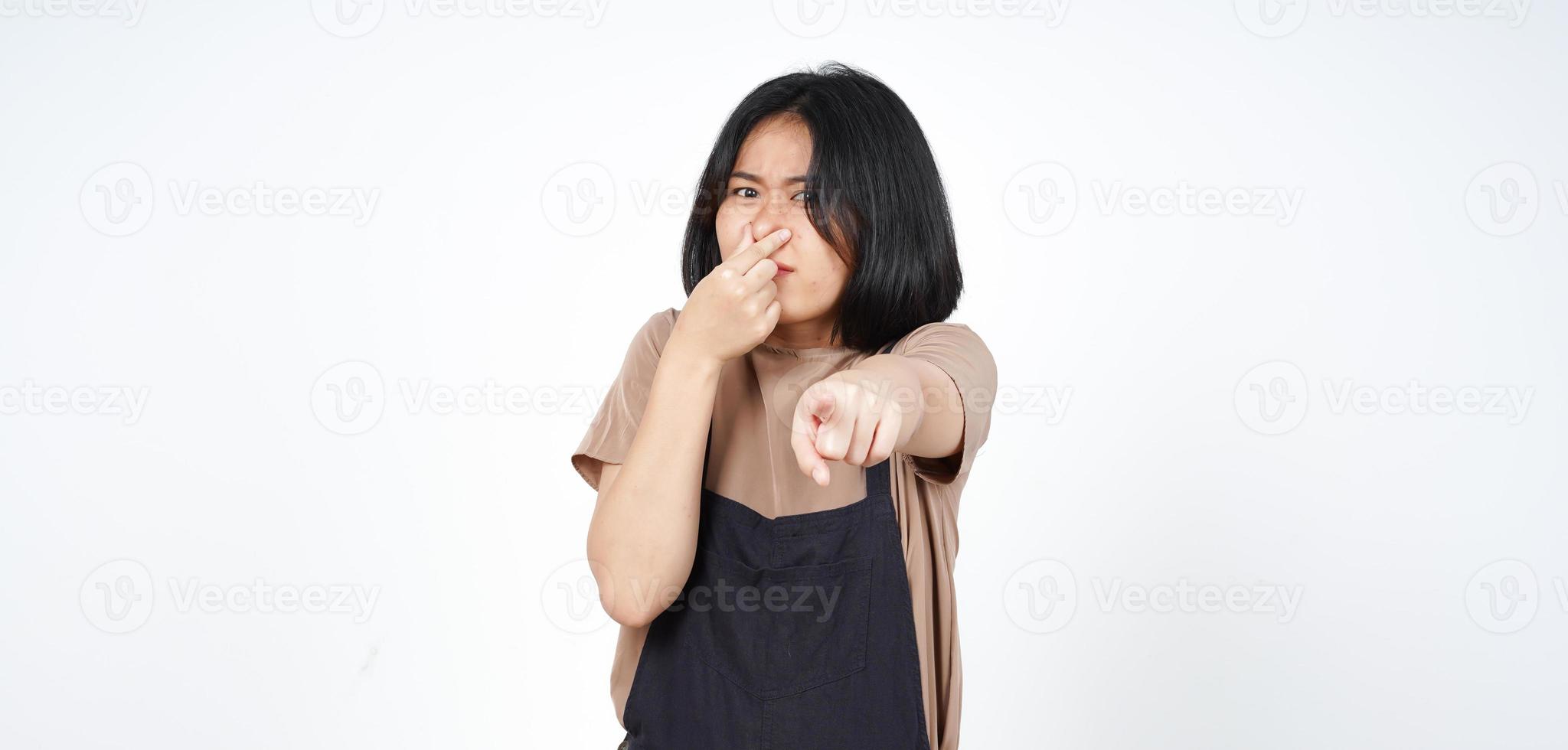 Smelling something stinky and disgusting of Beautiful Asian Woman Isolated On White Background photo