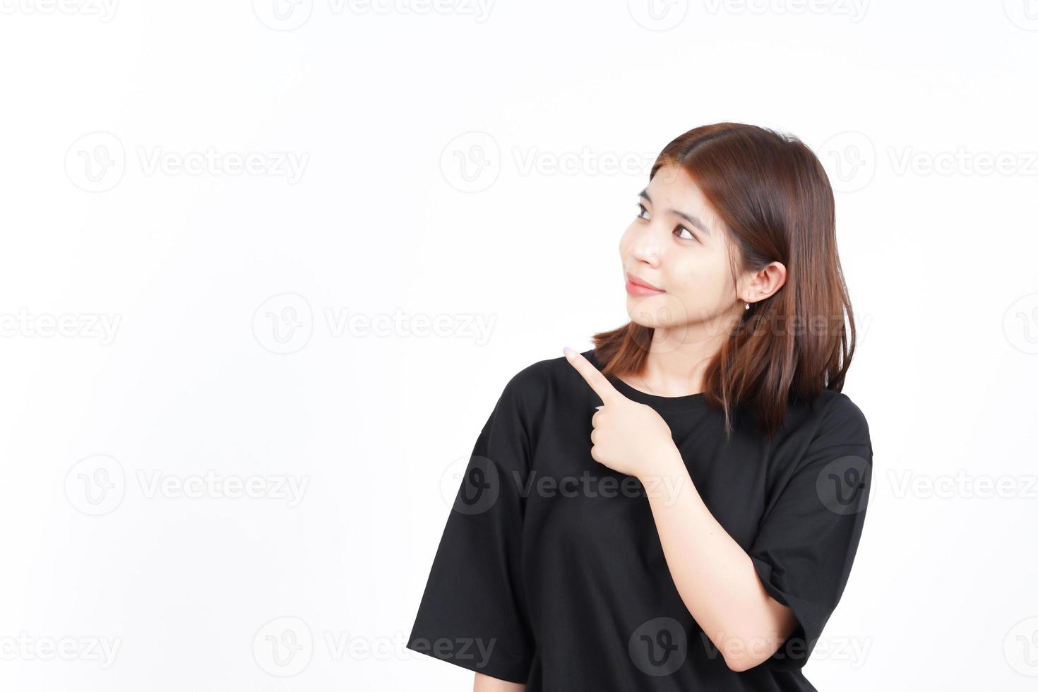 Showing Product and Pointing Side using forefinger Of Beautiful Asian Woman Isolated On White photo