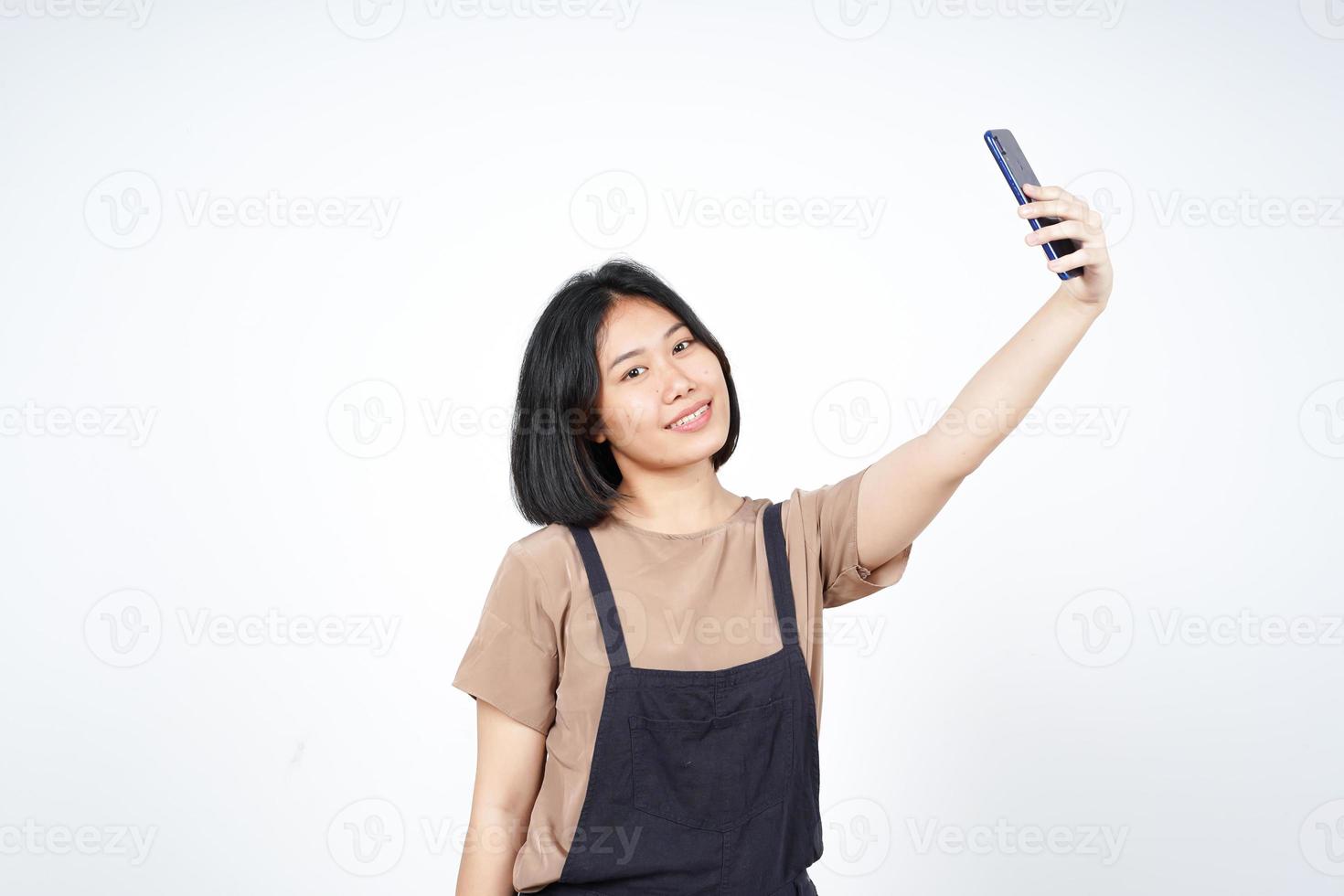 Take a Selfie using Smartphoneof Beautiful Asian Woman Isolated On White Background photo