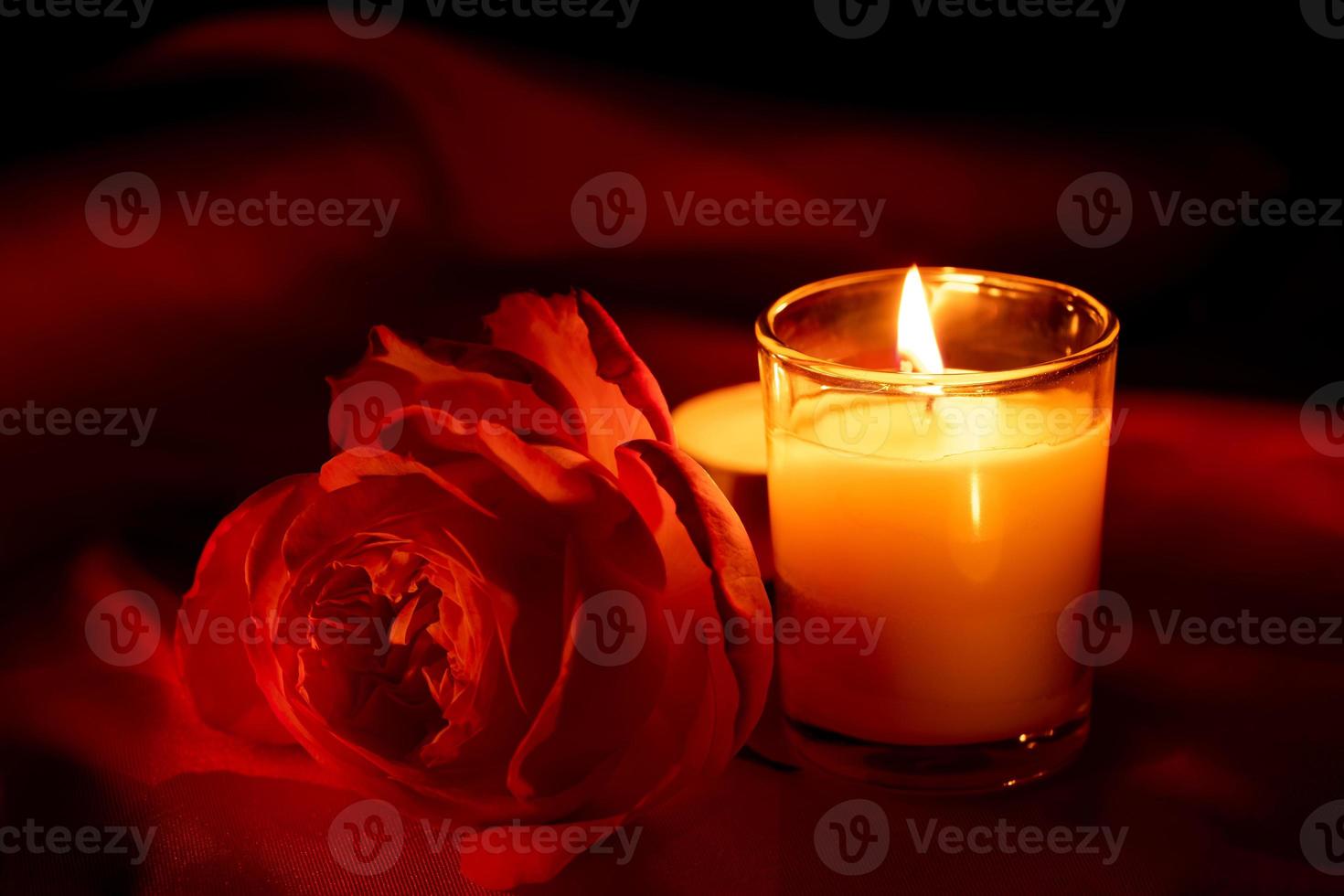 Scented candles in the dark night on a red cloth, ceremony, hope, romantic photo