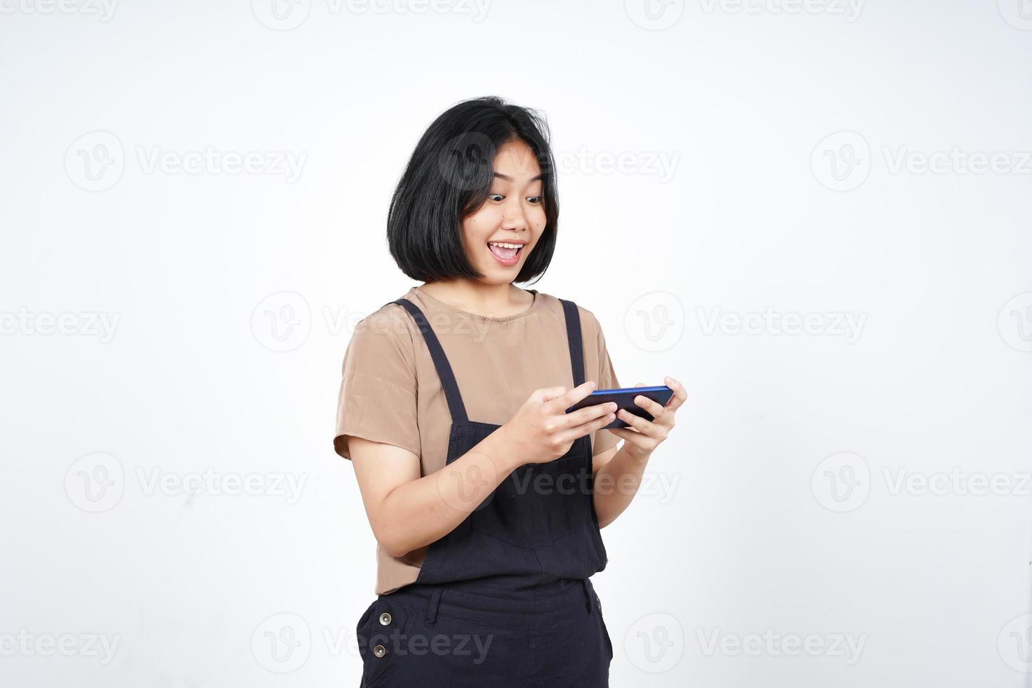 Playing Mobile Game on Smartphone of Beautiful Asian Woman Isolated On White Background photo