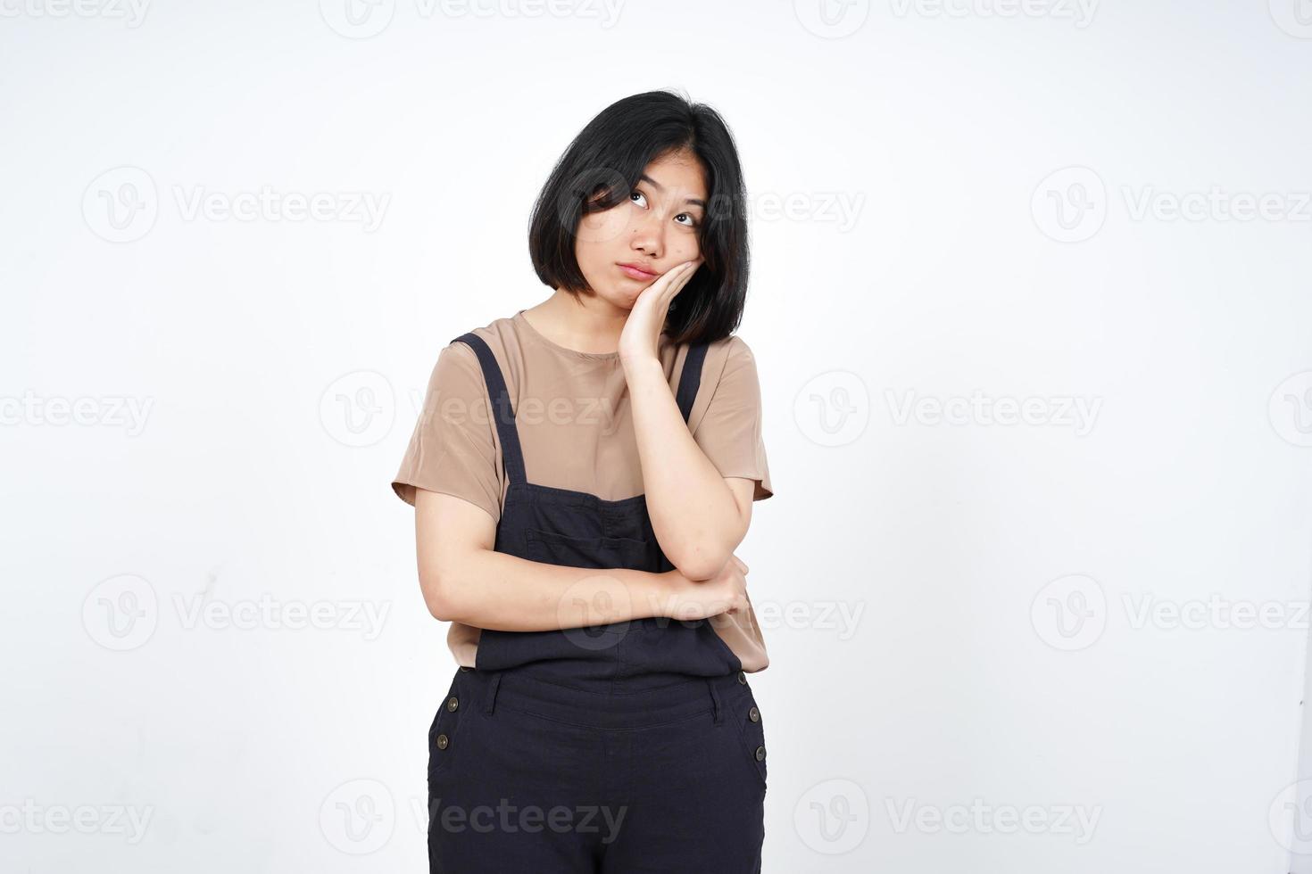 Looking up and Thinking of Beautiful Asian Woman Isolated On White Background photo