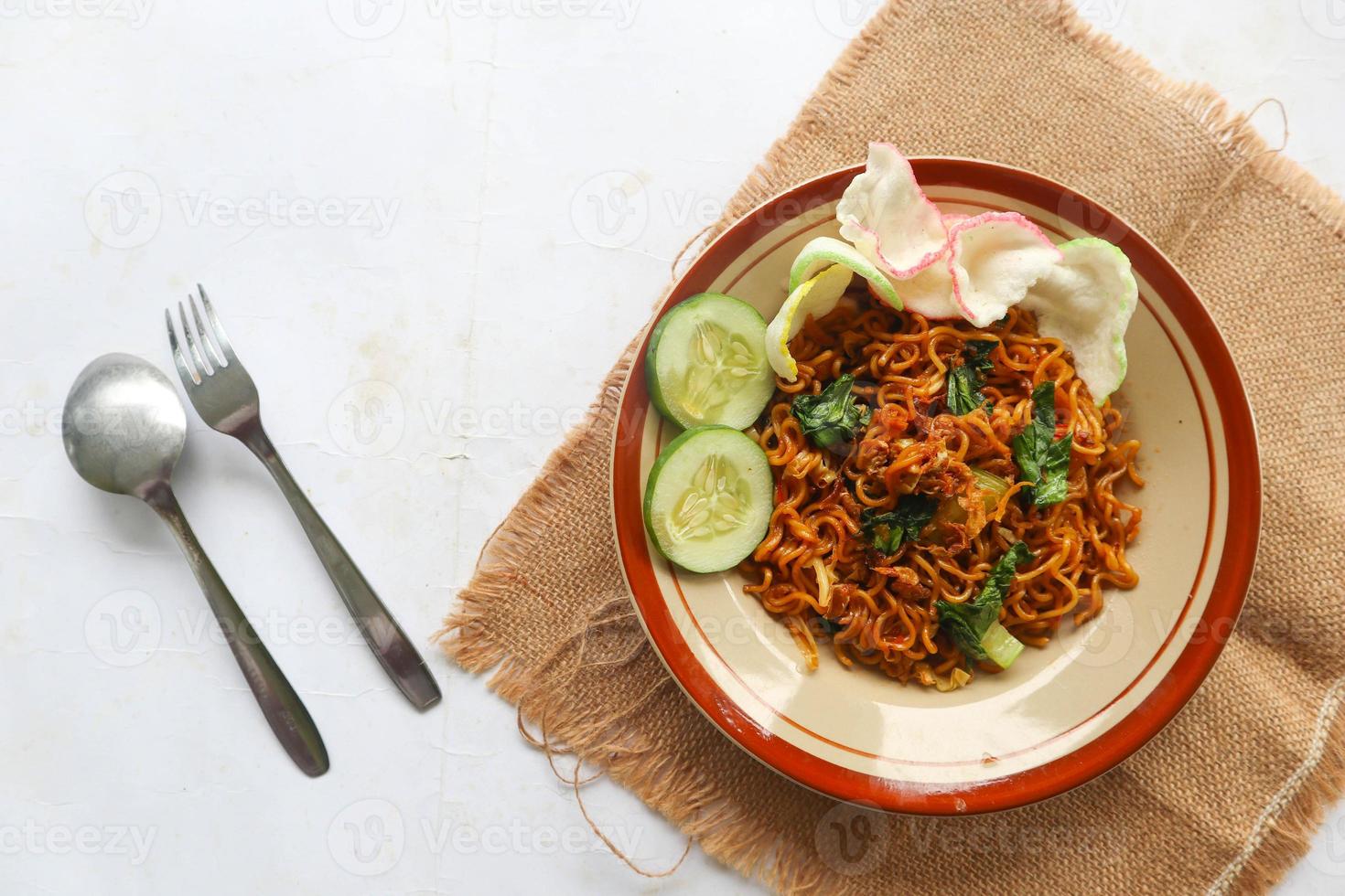 mie tek tek or fried noodle made with egg noodles with chicken, cabbage