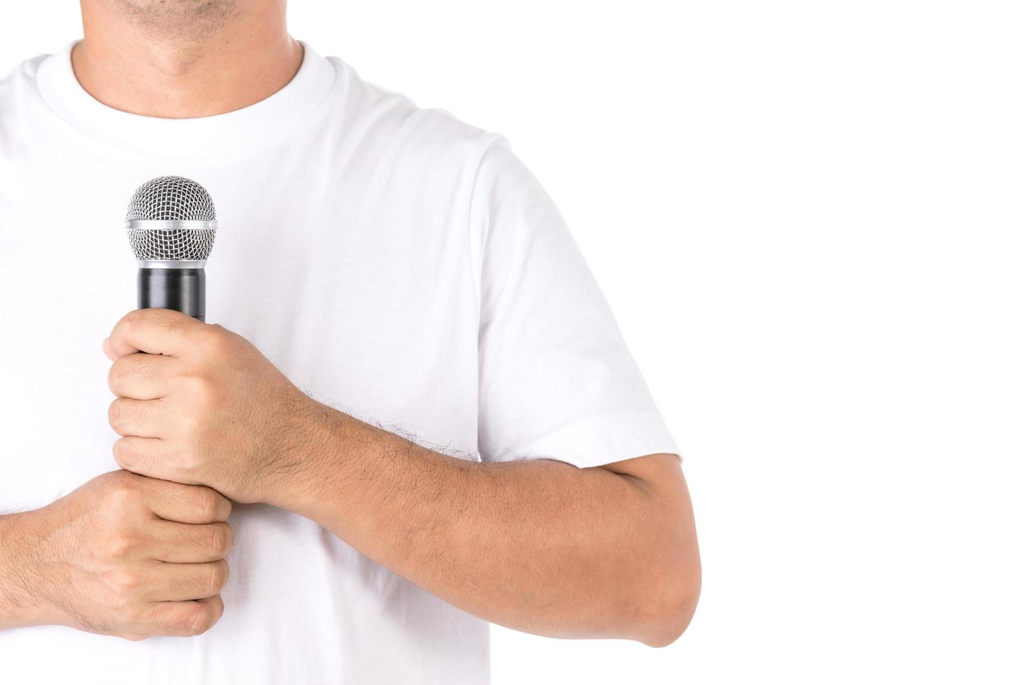 People holding black wireless microphone in studio. Isolated on white photo