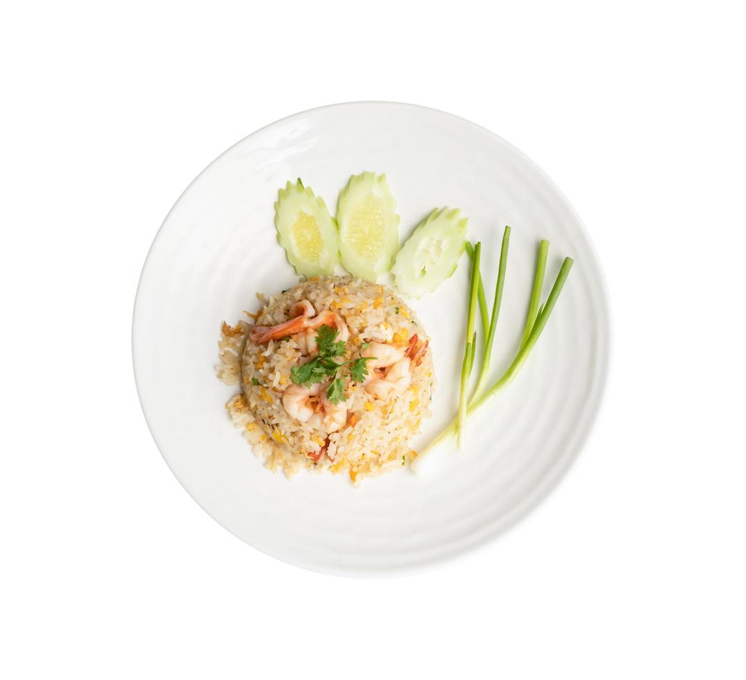 Fried rice with shrimp in round white dish isolated on white background. Thai Food concept photo