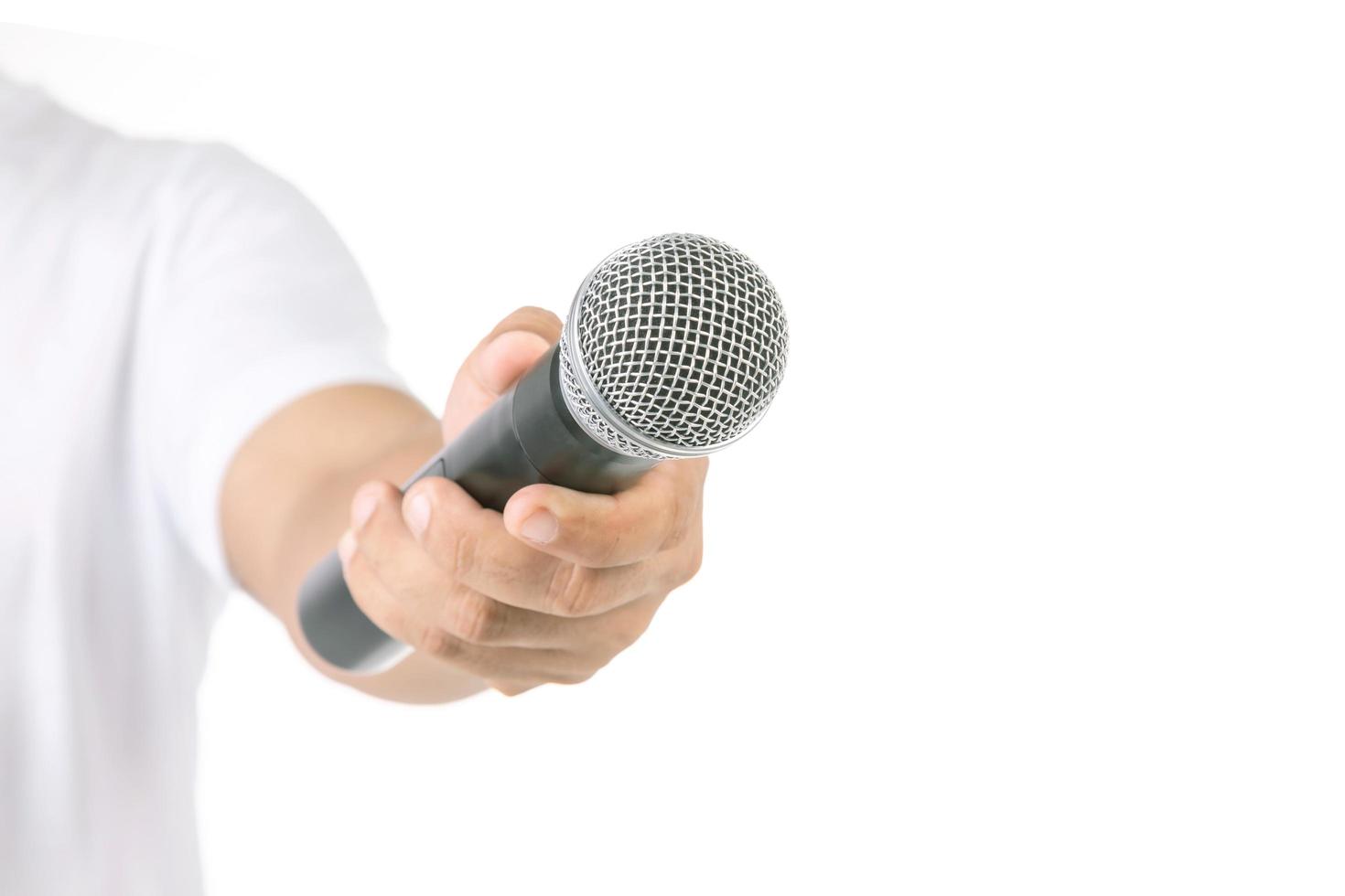 People holding black wireless microphone in studio. Isolated on white photo