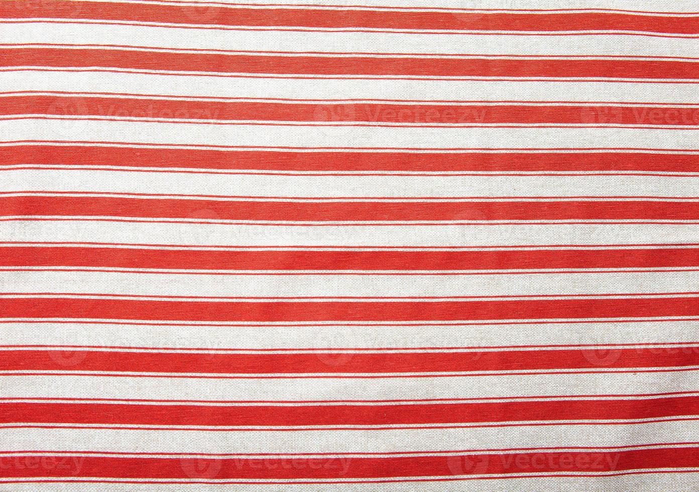 Red tablecloth texture, close-up. Checkered pattern fabric. photo