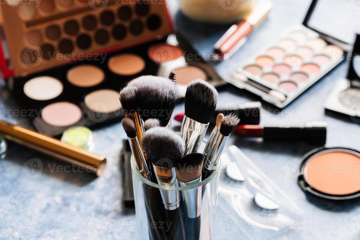makeup brushes table decorative cosmetics background. photo