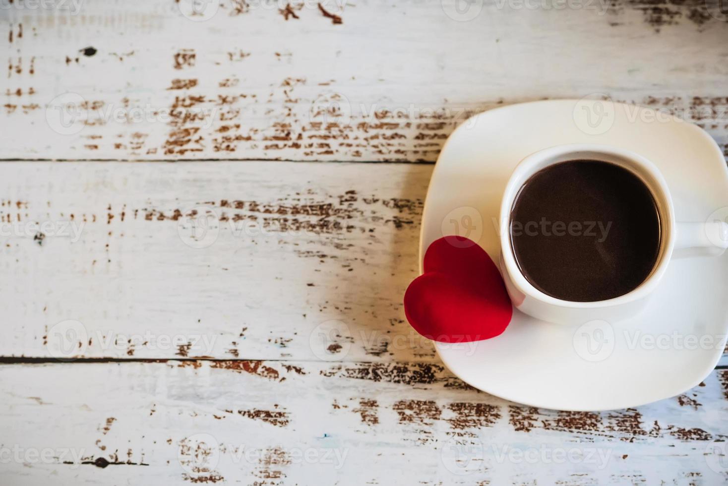 Red hearts and a Cup of coffee. the concept of Women's Valentine's Day. Place for text, place for copying. photo