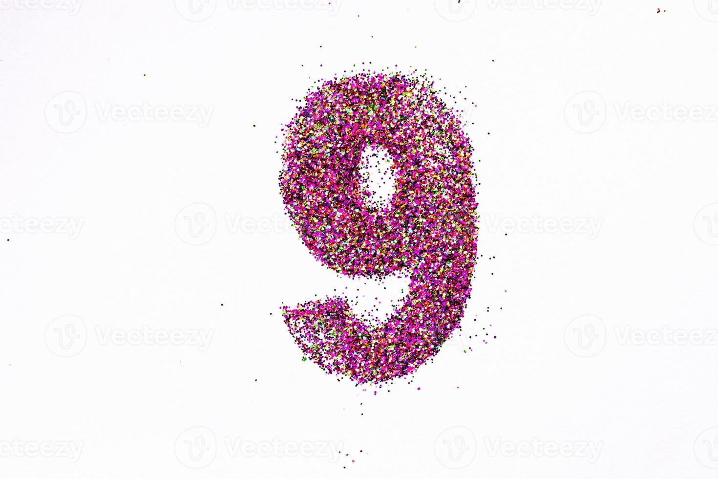 Figure 9 of bright sequins on white background photo