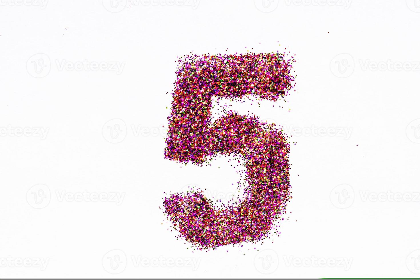 Figure 5 of bright sequins on white background photo