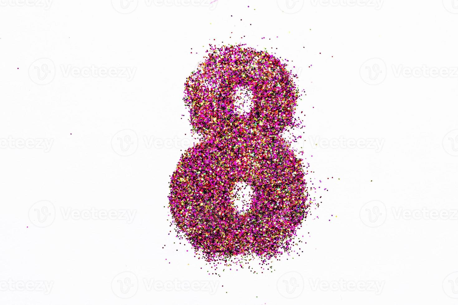 Figure 8 of bright sequins on white background photo