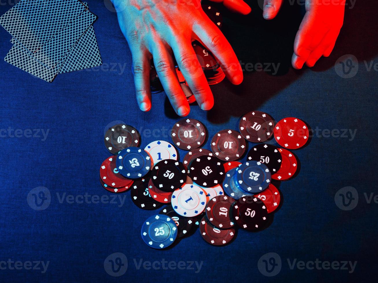 men's hands place a bet with playing chips photo