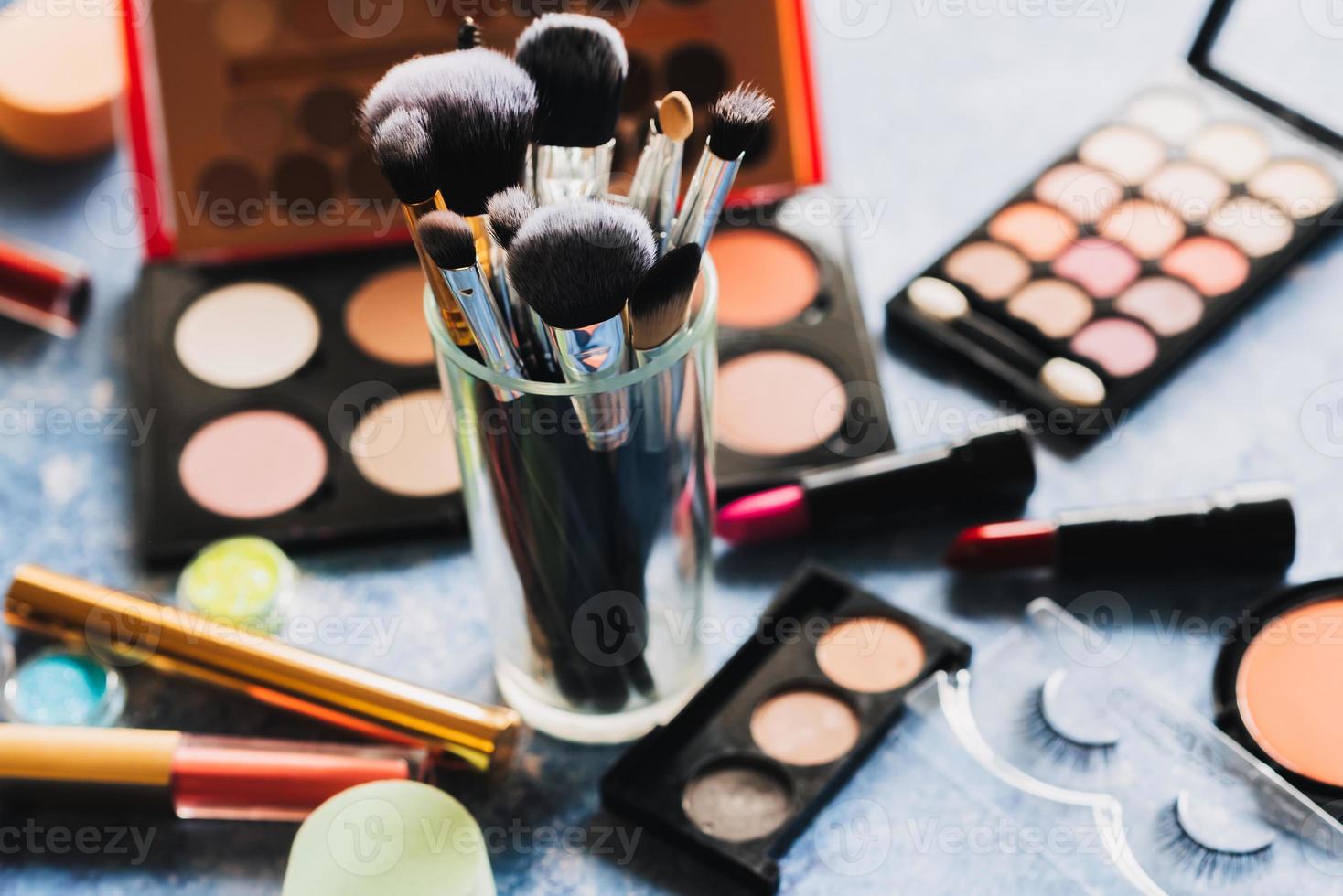 makeup brushes table decorative cosmetics background. photo