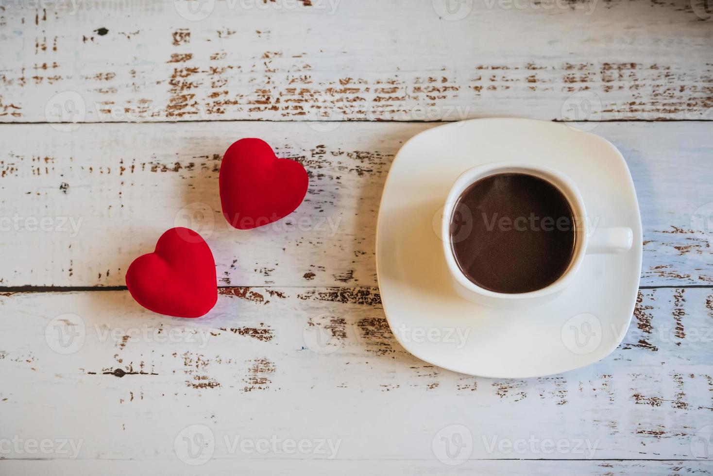 Red hearts and a Cup of coffee. the concept of Women's Valentine's Day. Place for text, place for copying. photo