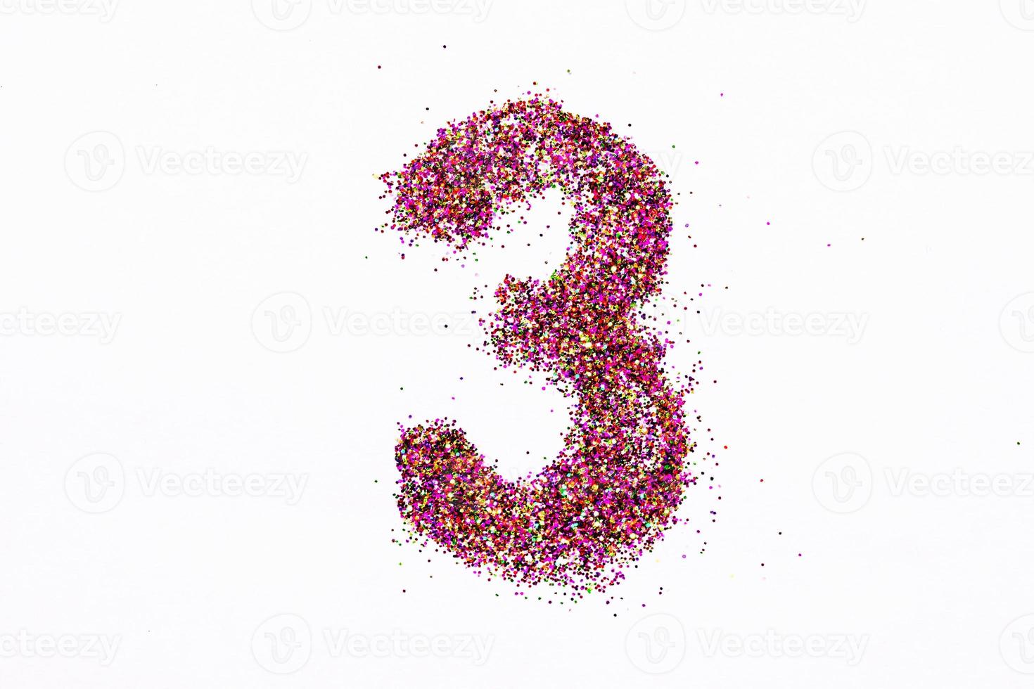 Figure 3 of bright sequins on white background photo