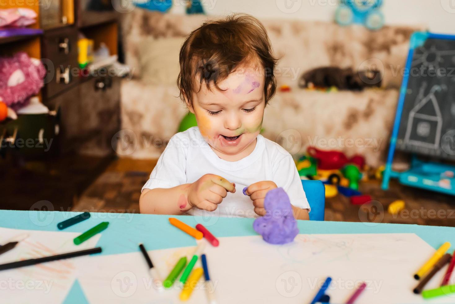 the boy is engaged in modeling from dough for modeling figures photo