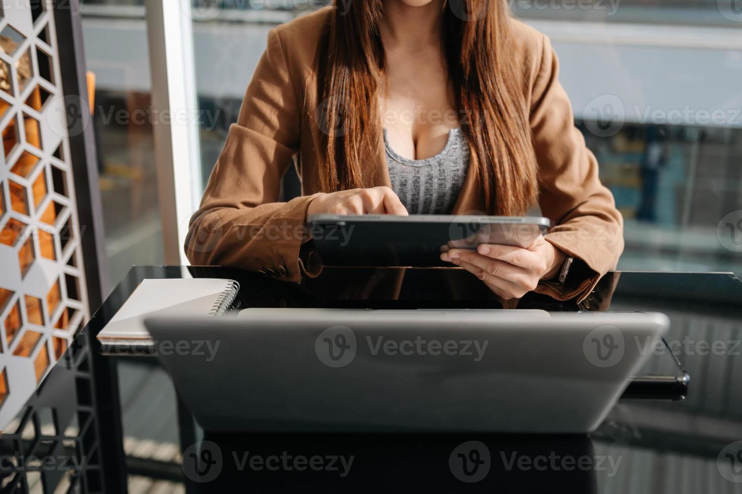 businessman working with digital tablet computer and smart phone with financial business strategy layer effect on desk in morning light photo