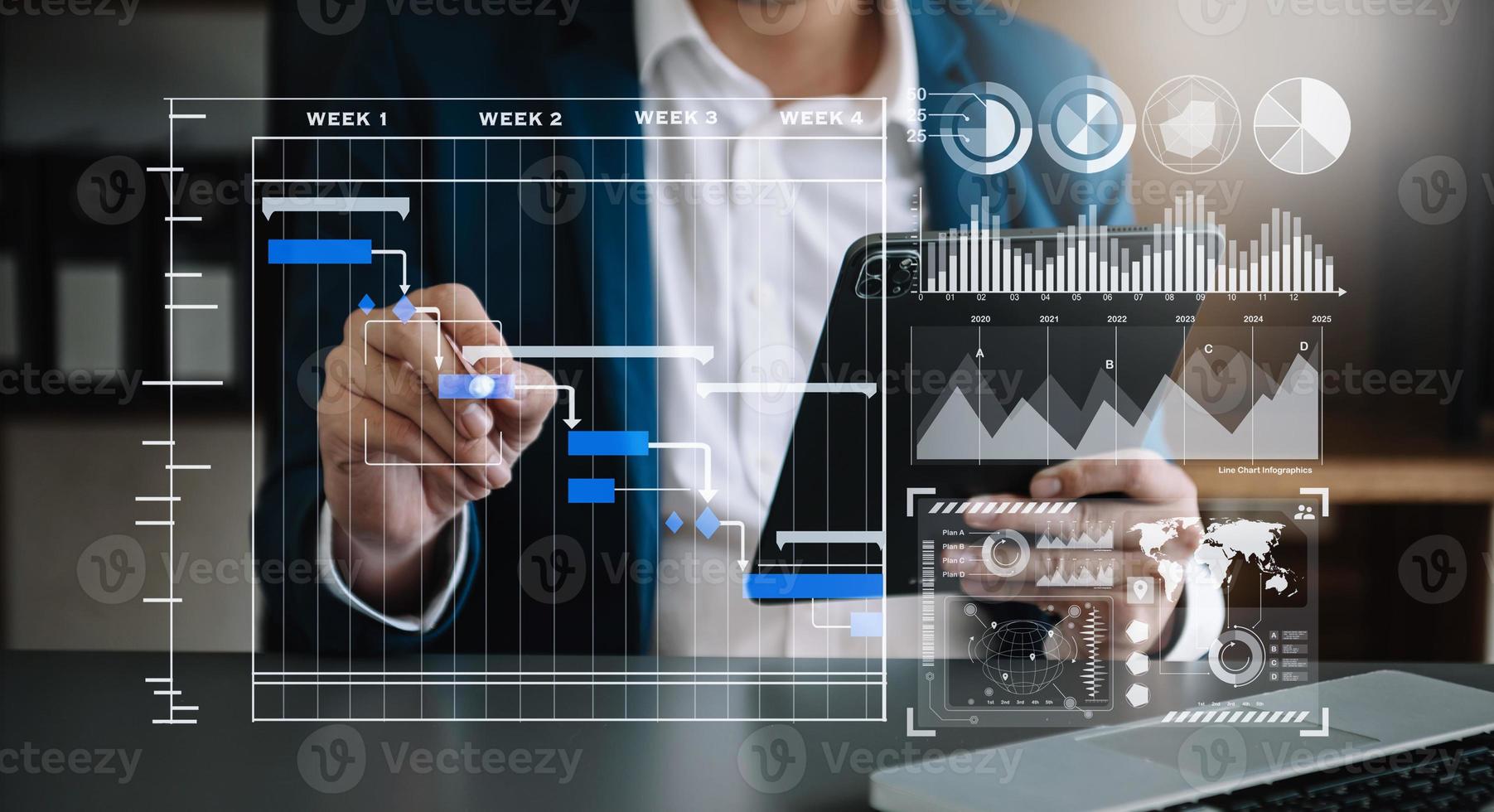 Businessman hand Project manager working and update tasks and Gantt chart scheduling virtual diagram.with smart phone, tablet and laptop photo