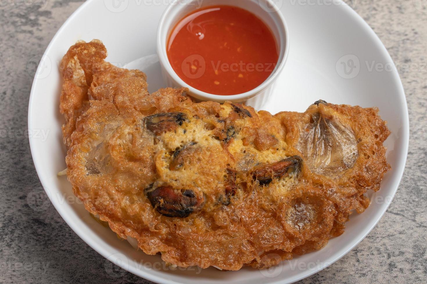 Fried mussels in crispy batter in a white plate photo