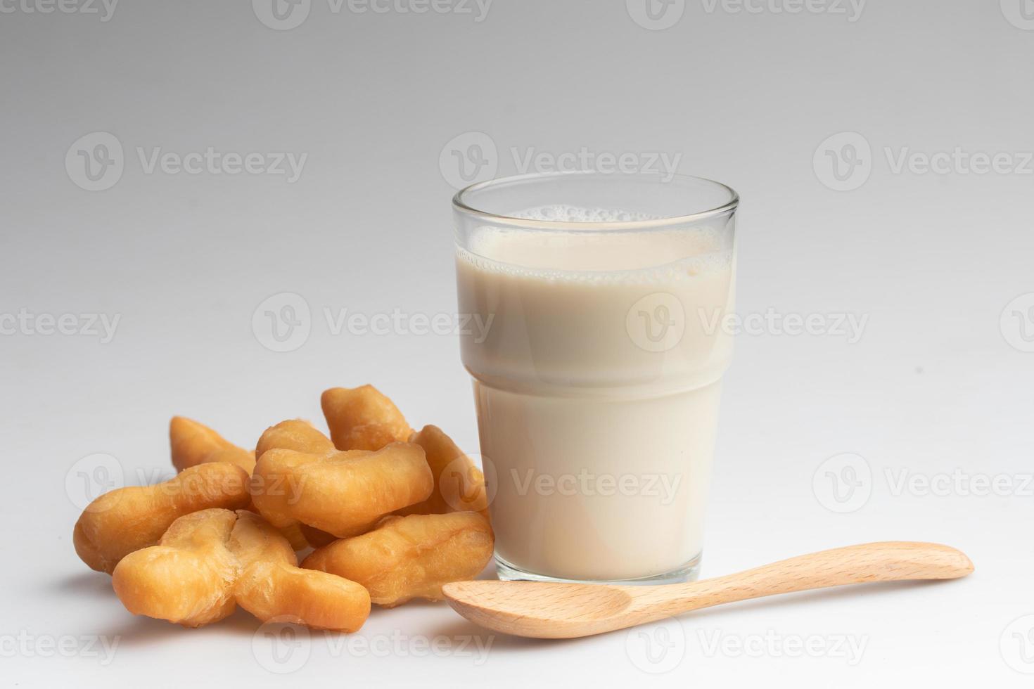 Soy milk and Patongo on white background photo