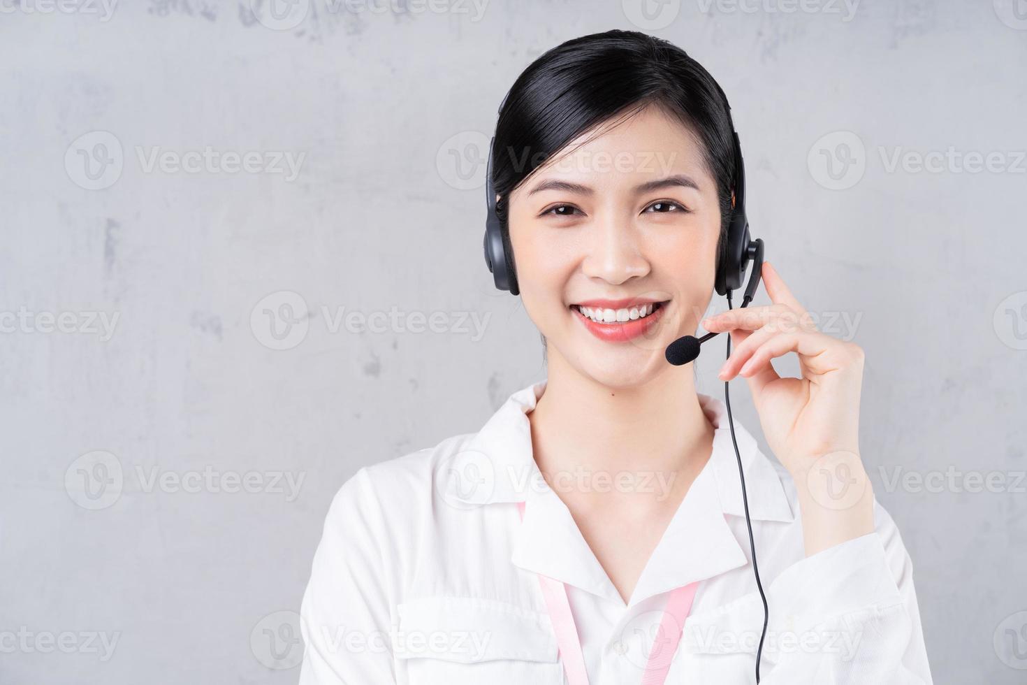 Portrait of young Asian operator on background photo