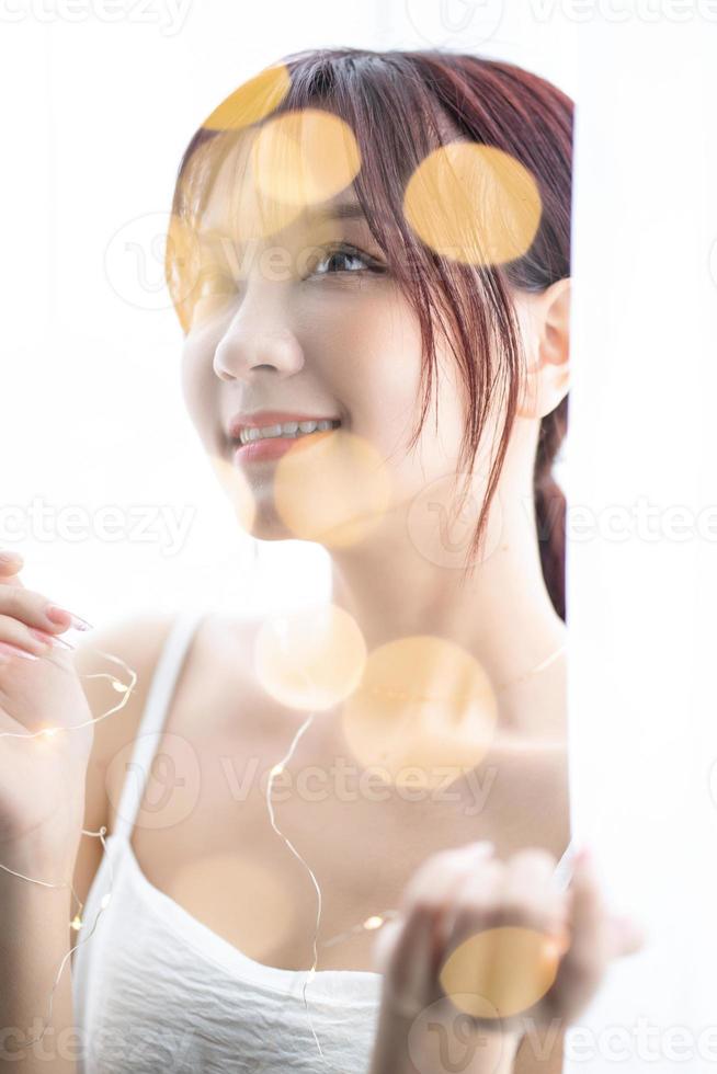 Beauty image of young Asian woman at home in the morning photo