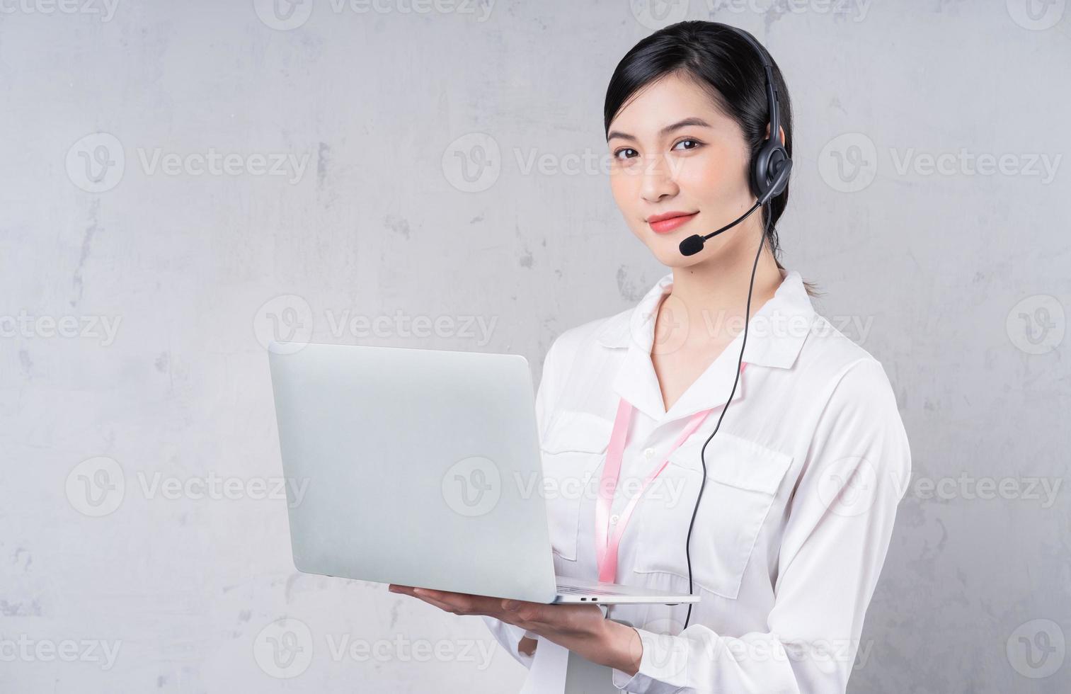 Portrait of young Asian operator on background photo