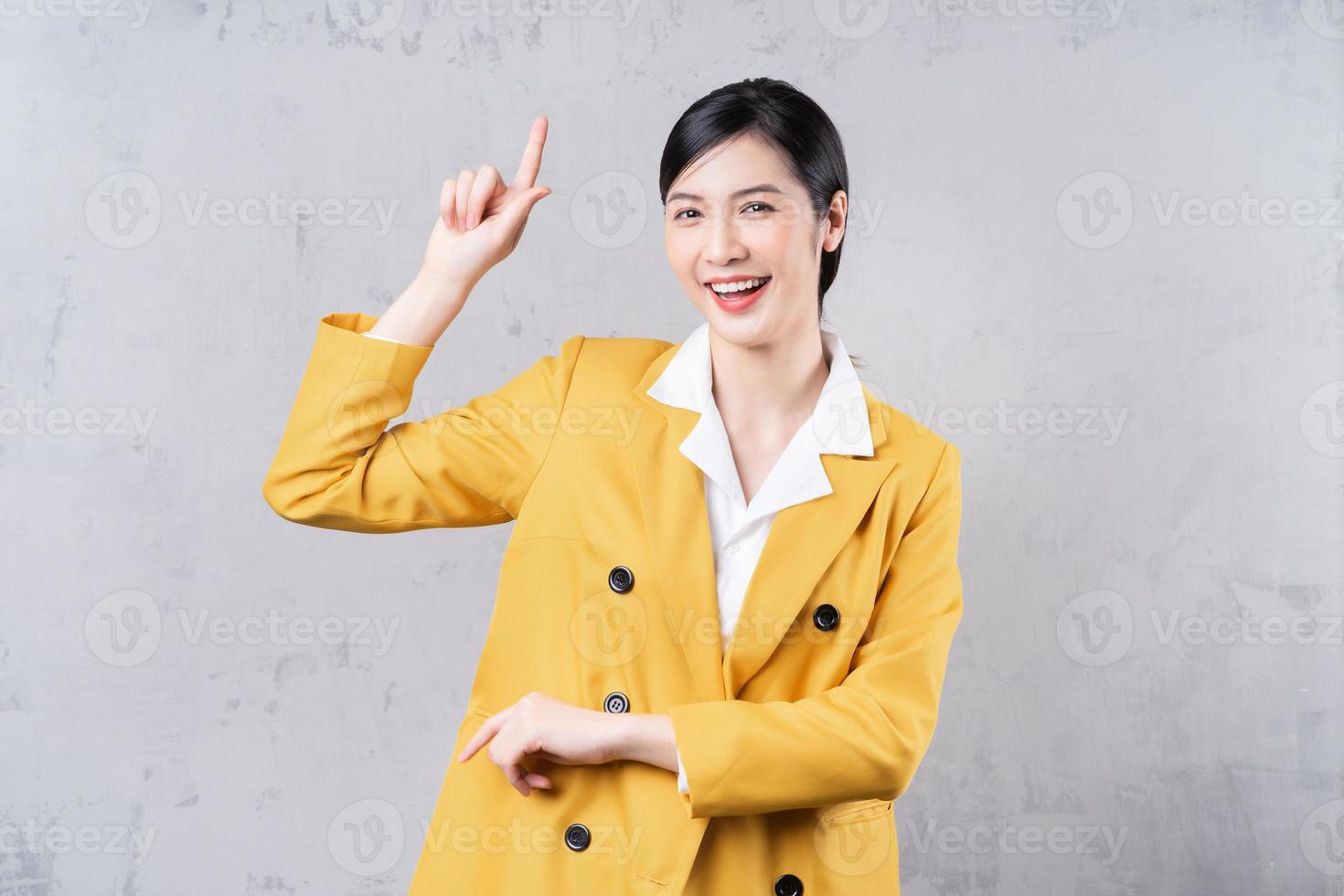 Portrait of young Asian businesswoman on background photo