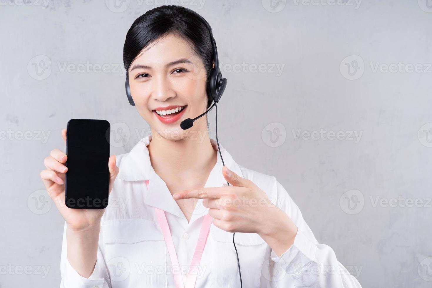 Portrait of young Asian operator on background photo