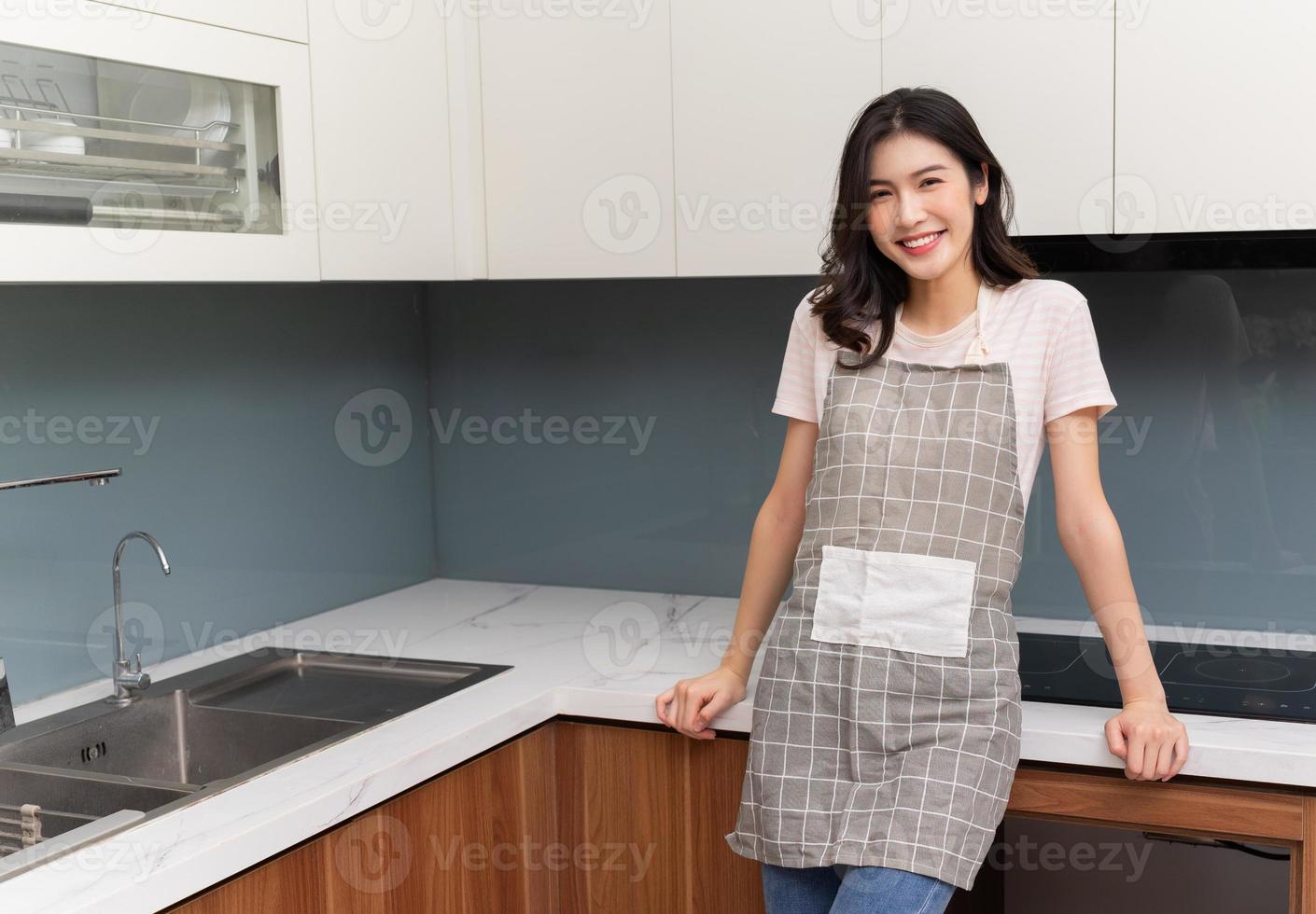 Image of young Asian woman at home photo