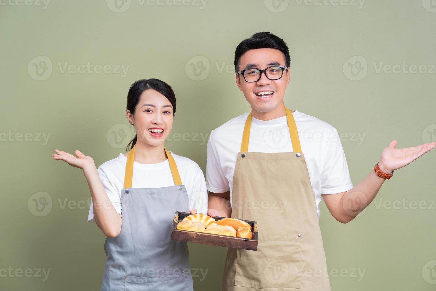 Photo of two Asian staff on background