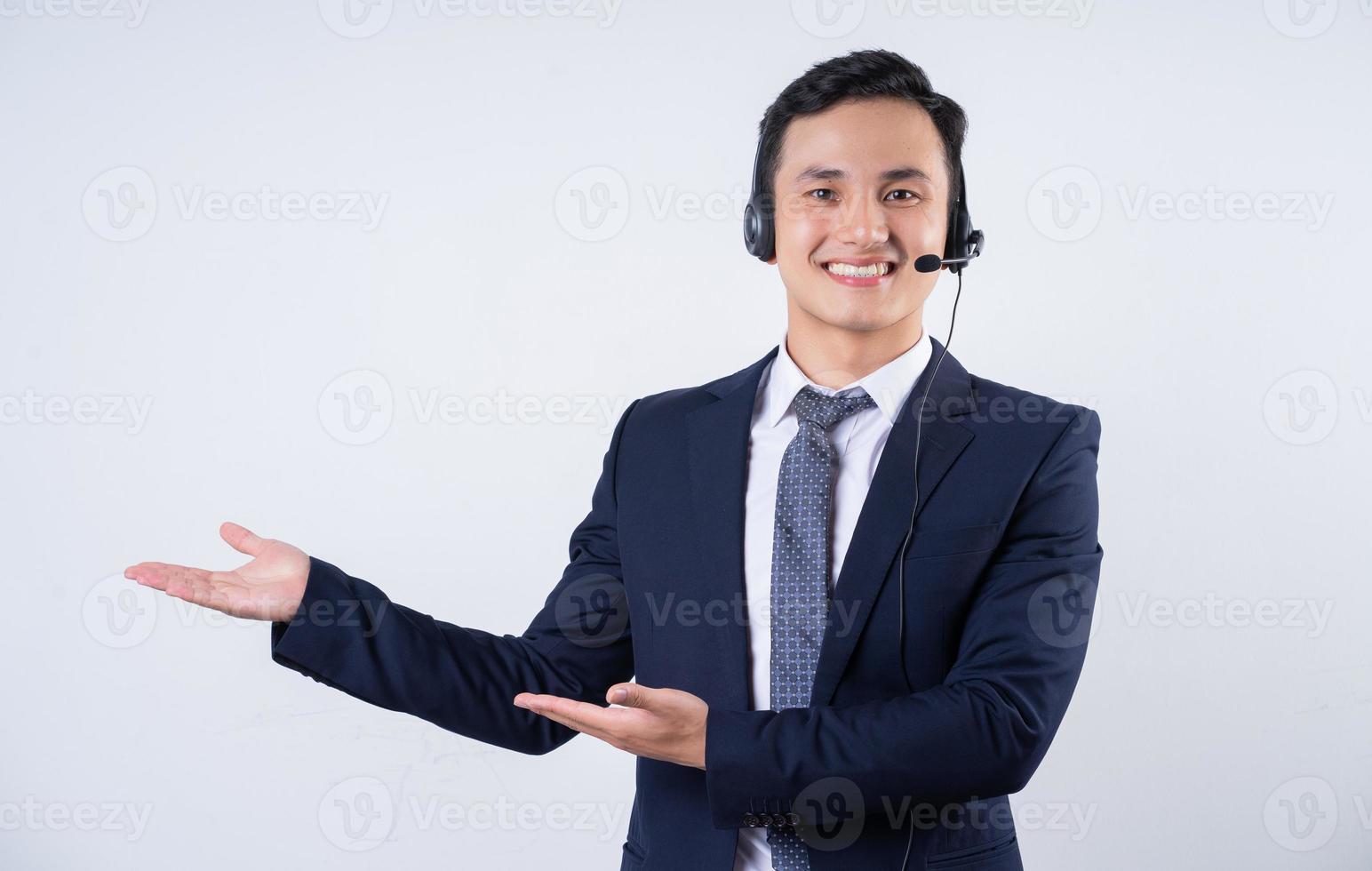 Image of young Asian businessman on background photo