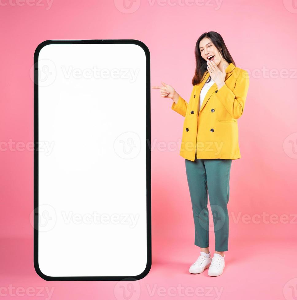 Image of young Asian businesswoman with smartphone mock up photo