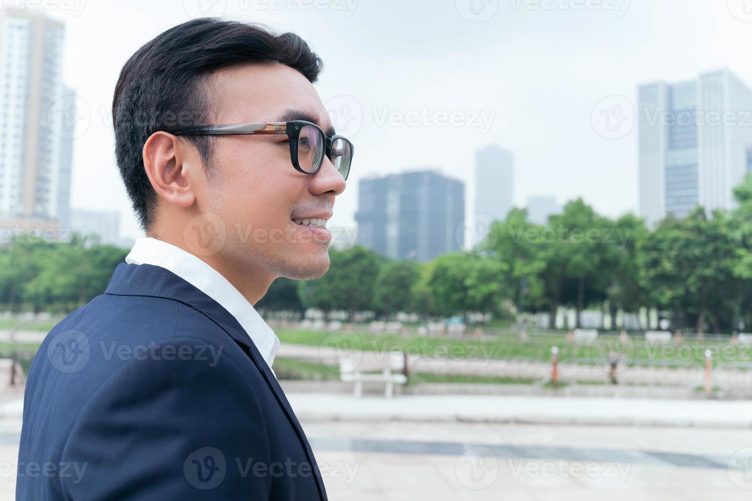 Photo of Asian businessman outdoors