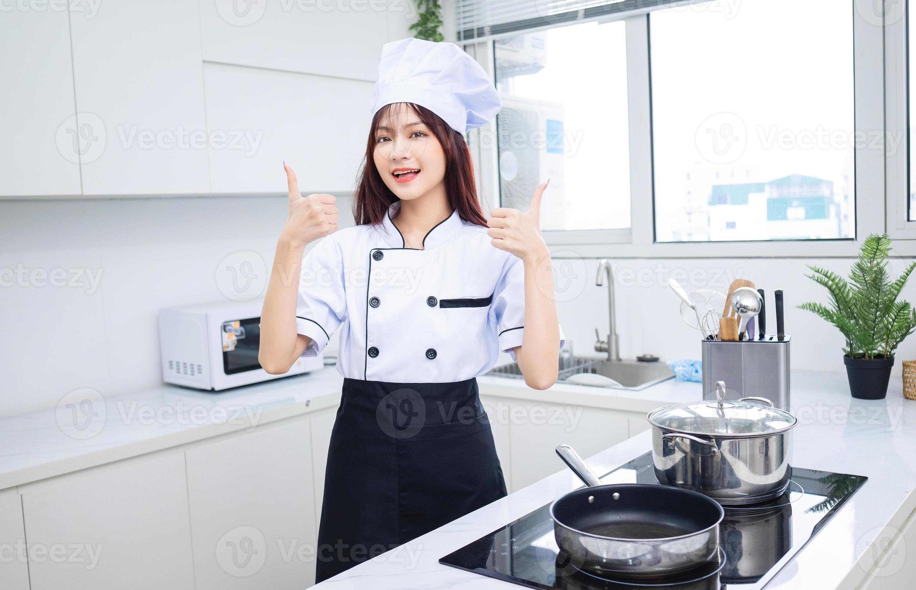 Image of young Asian woman chef in the kitchen 17564293 Stock Photo at