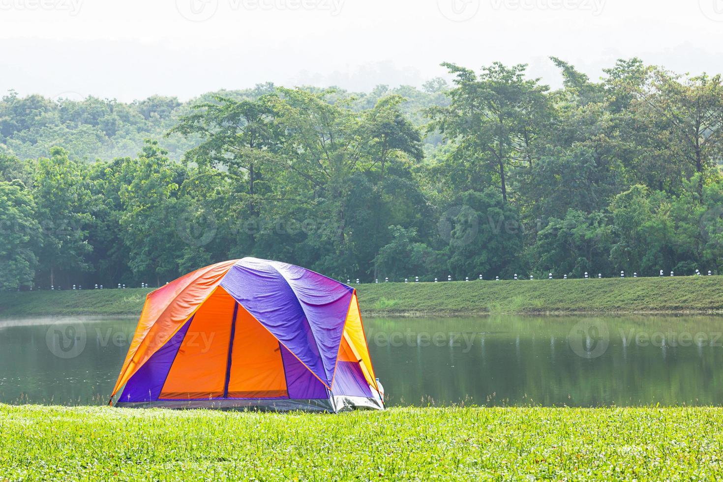 Dome tent camping at lake side photo