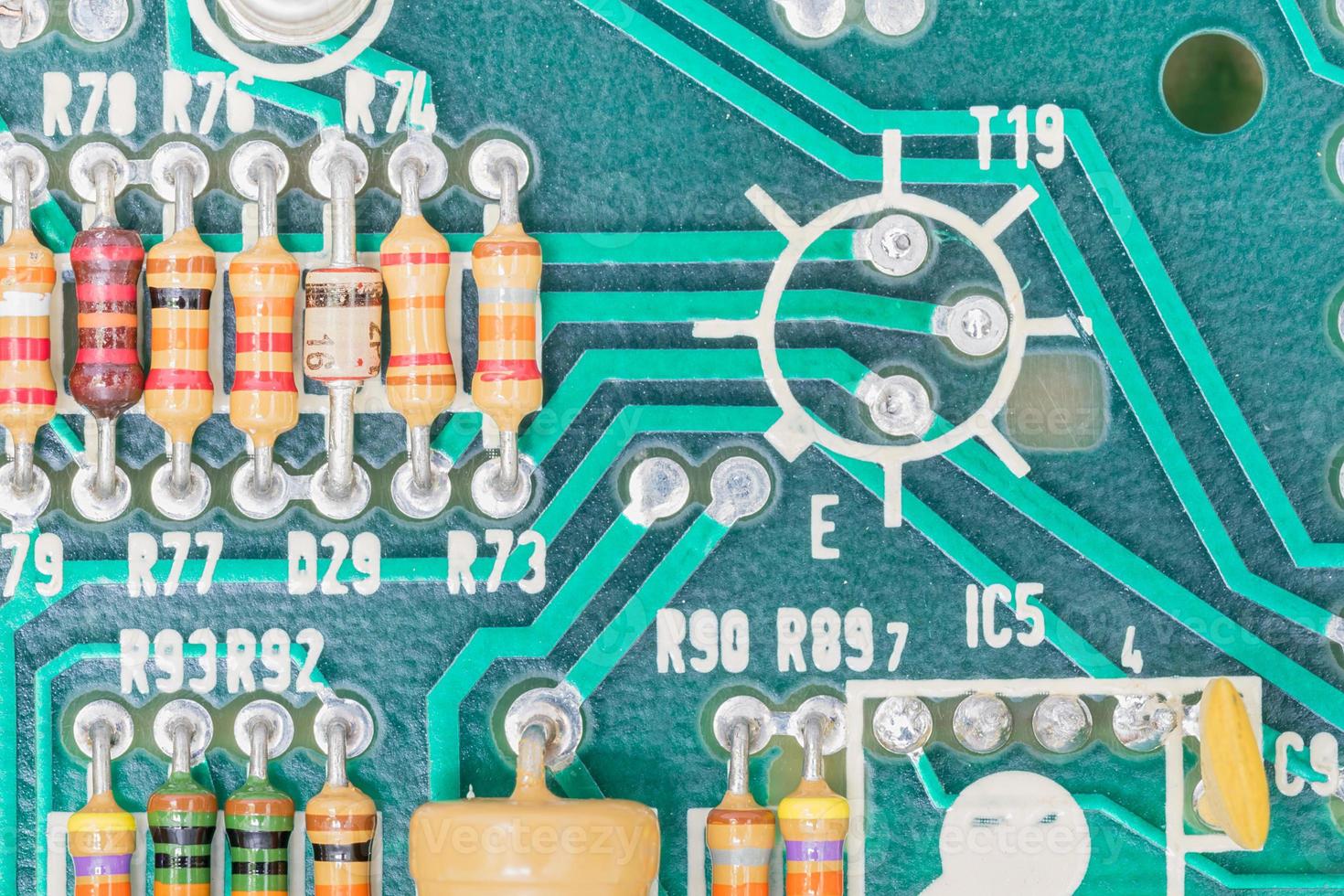 Condensers and Resistor assembly on the circuit board photo
