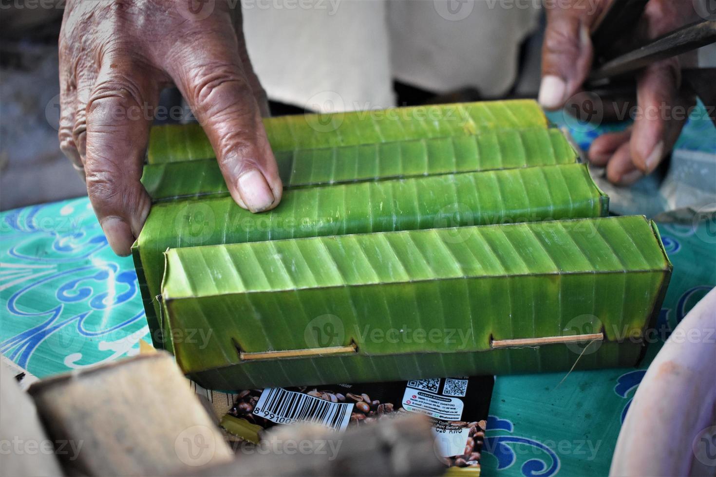 traditional food wrapped in banana leaves photo