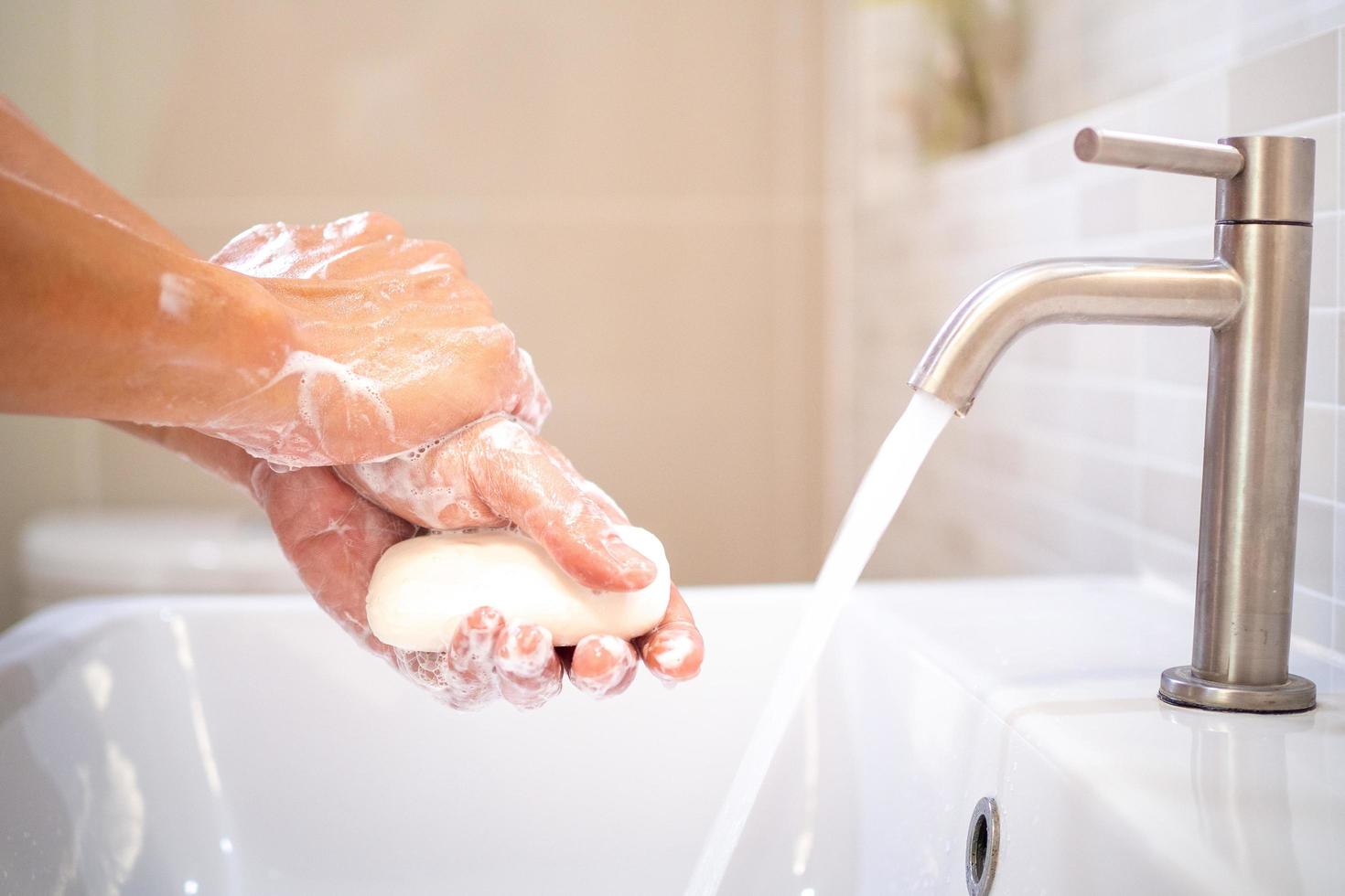 Wash your hands and rub with soap for at least 20 seconds to prevent the corona virus or Covid-19. Stop the spread of the corona virus and for good hygiene. photo