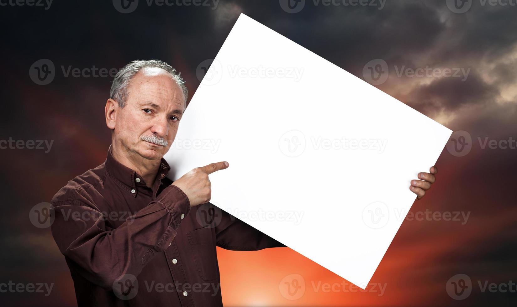 man holding billboard photo