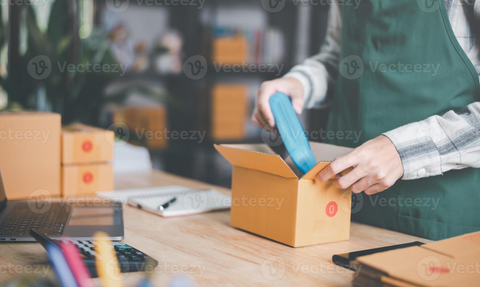 Startups or Small Business Entrepreneurs, Pack products for delivery, manage orders in online stores, shop online, sell online on the internet, SME, e-commerce,dropshipping delivery service concept photo