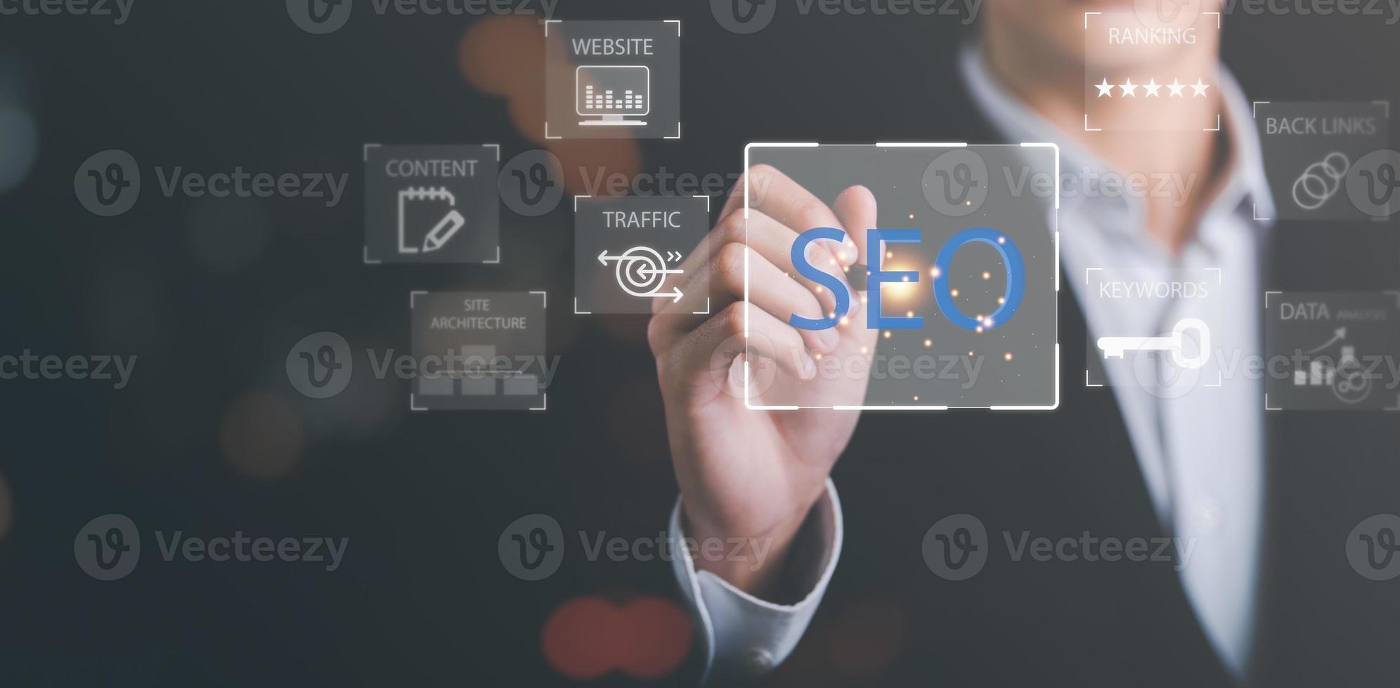 Marketer holding pen pointing to icon and shows SEO concepts, optimization analysis tools, search engine rankings, social media sites based on results analysis data,Ranking the best sites for search photo
