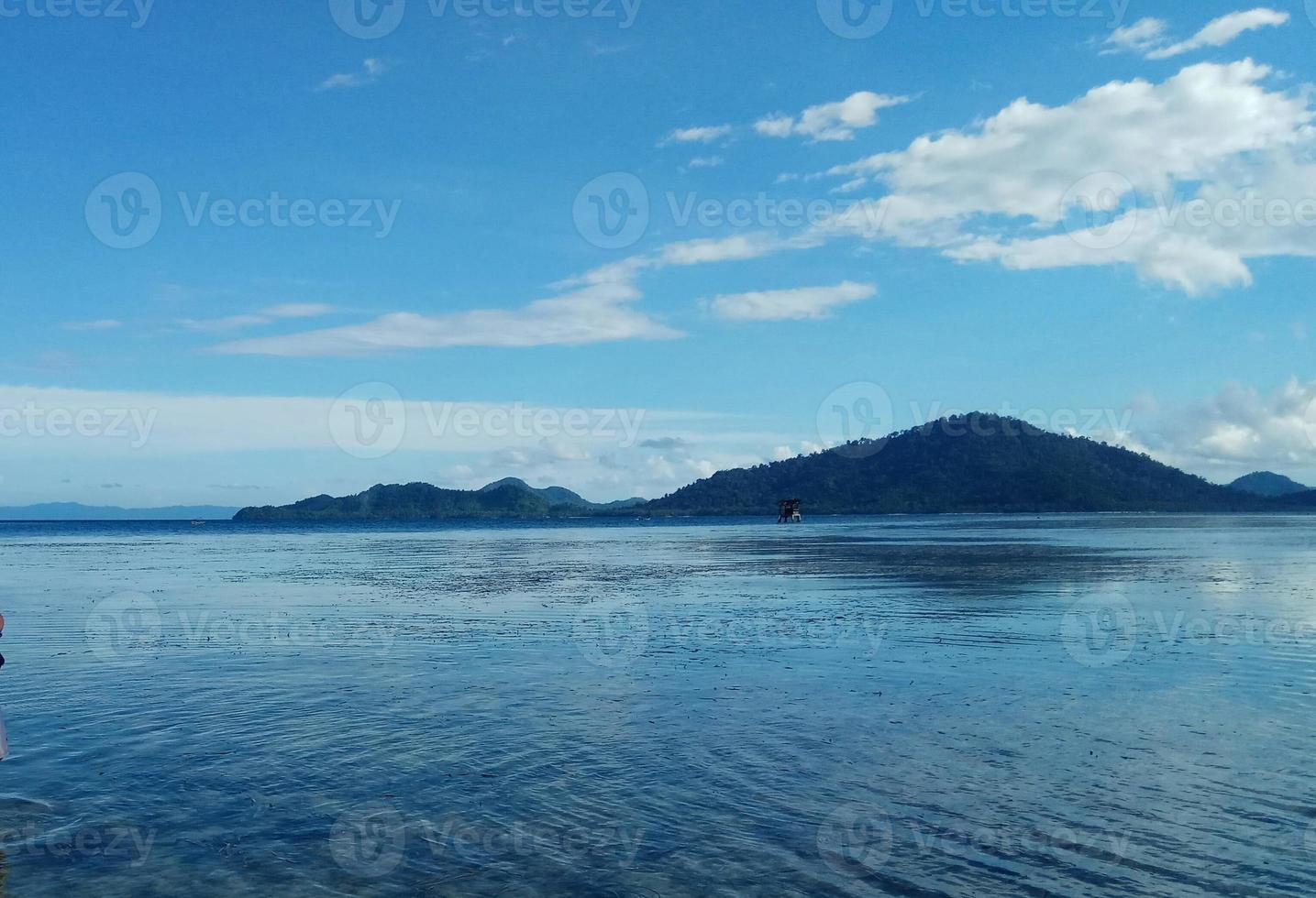 Island on ocean mirror view photo