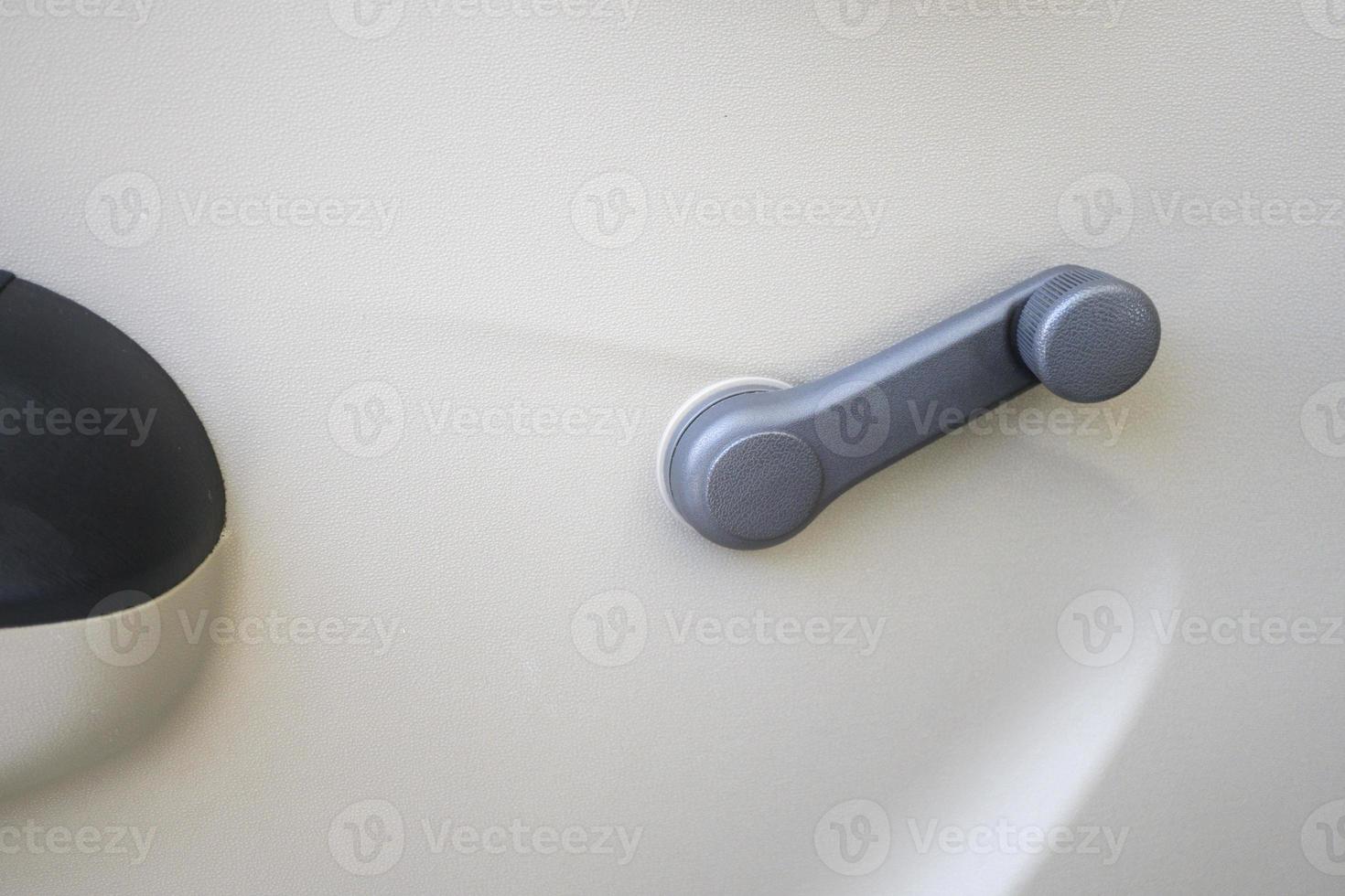 Close up non electric manual car window hand crank 17598501 Stock Photo