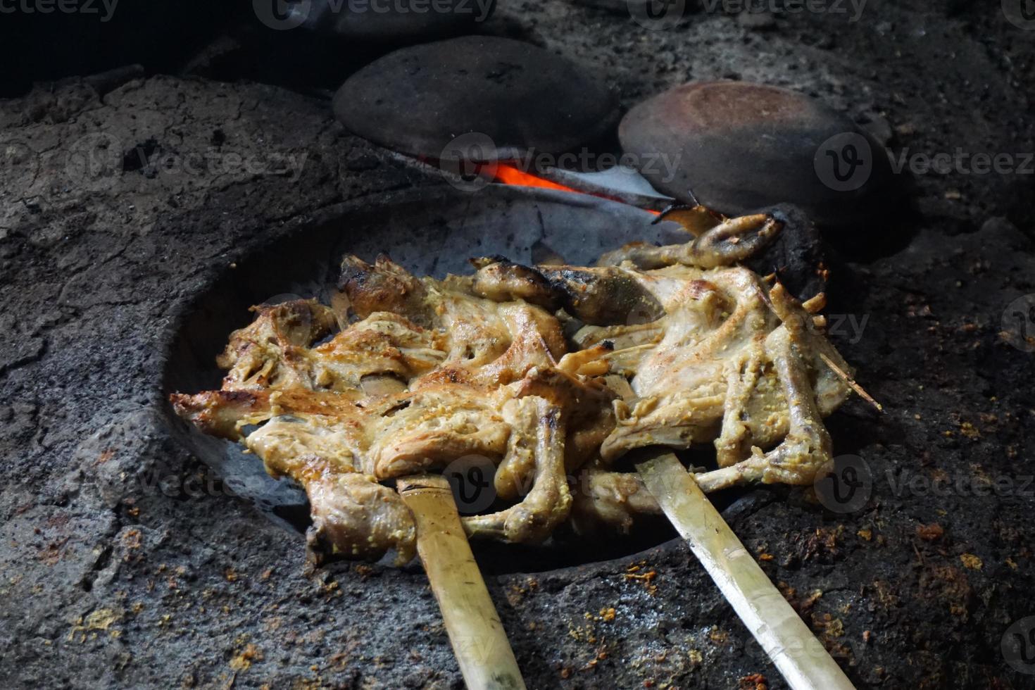 Grilled chicken with garlic seasoning cooked in the traditional photo