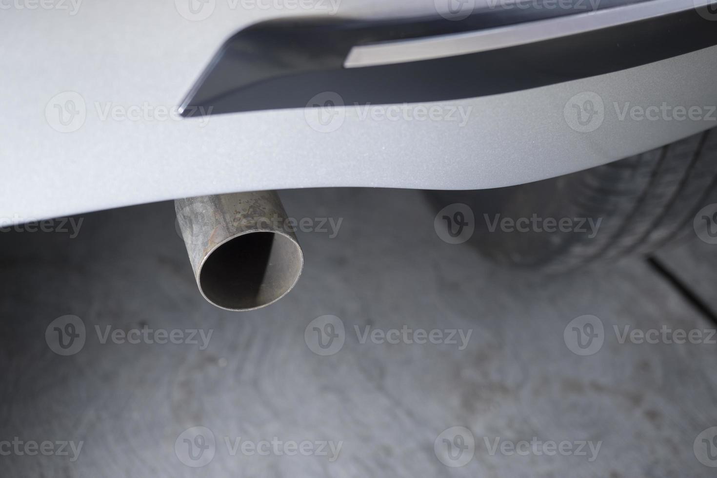 close up of the original car exhaust pipe that is installed properly photo
