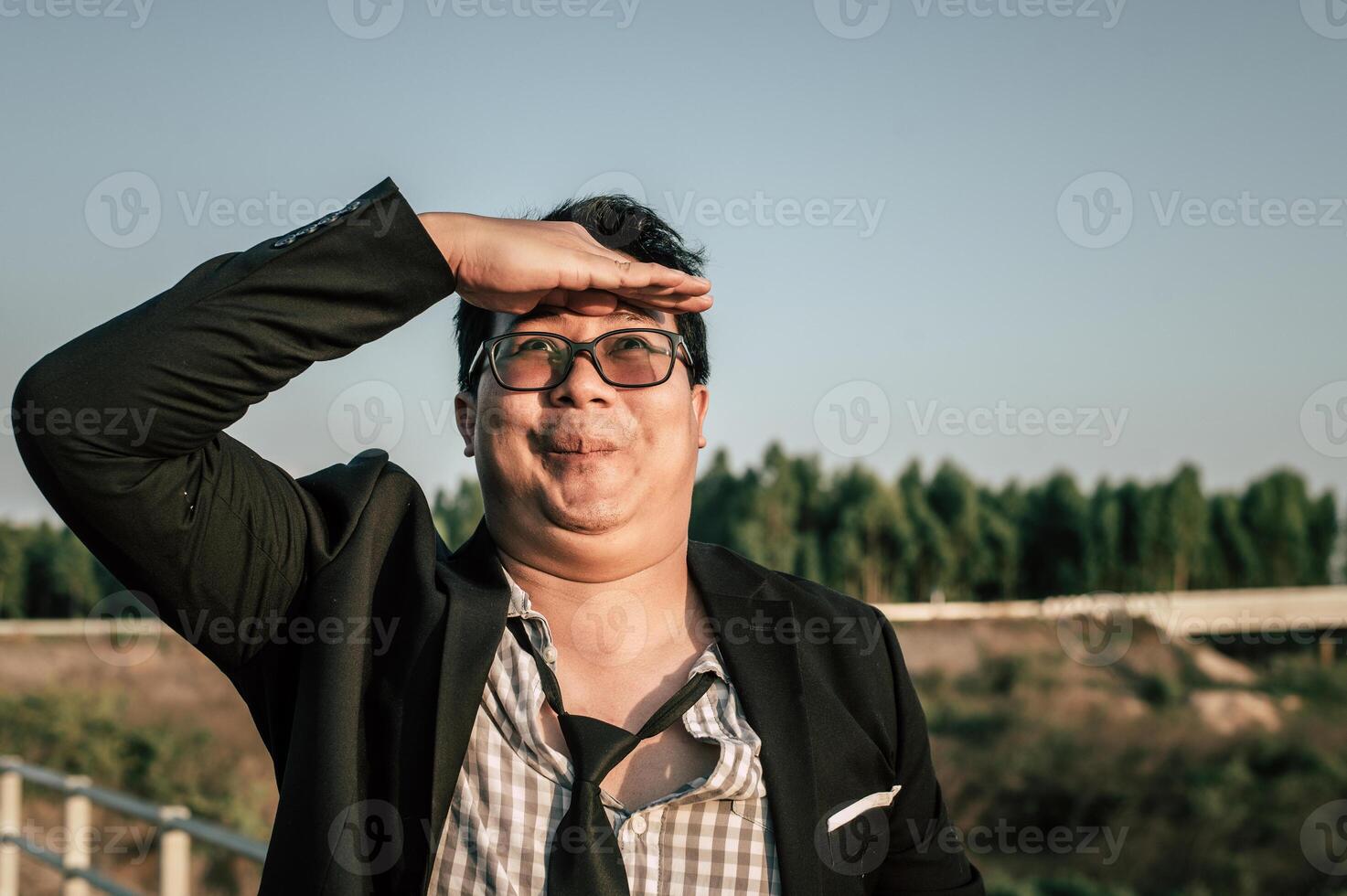 Young funny businessman man in crazy and funny manner posture photo