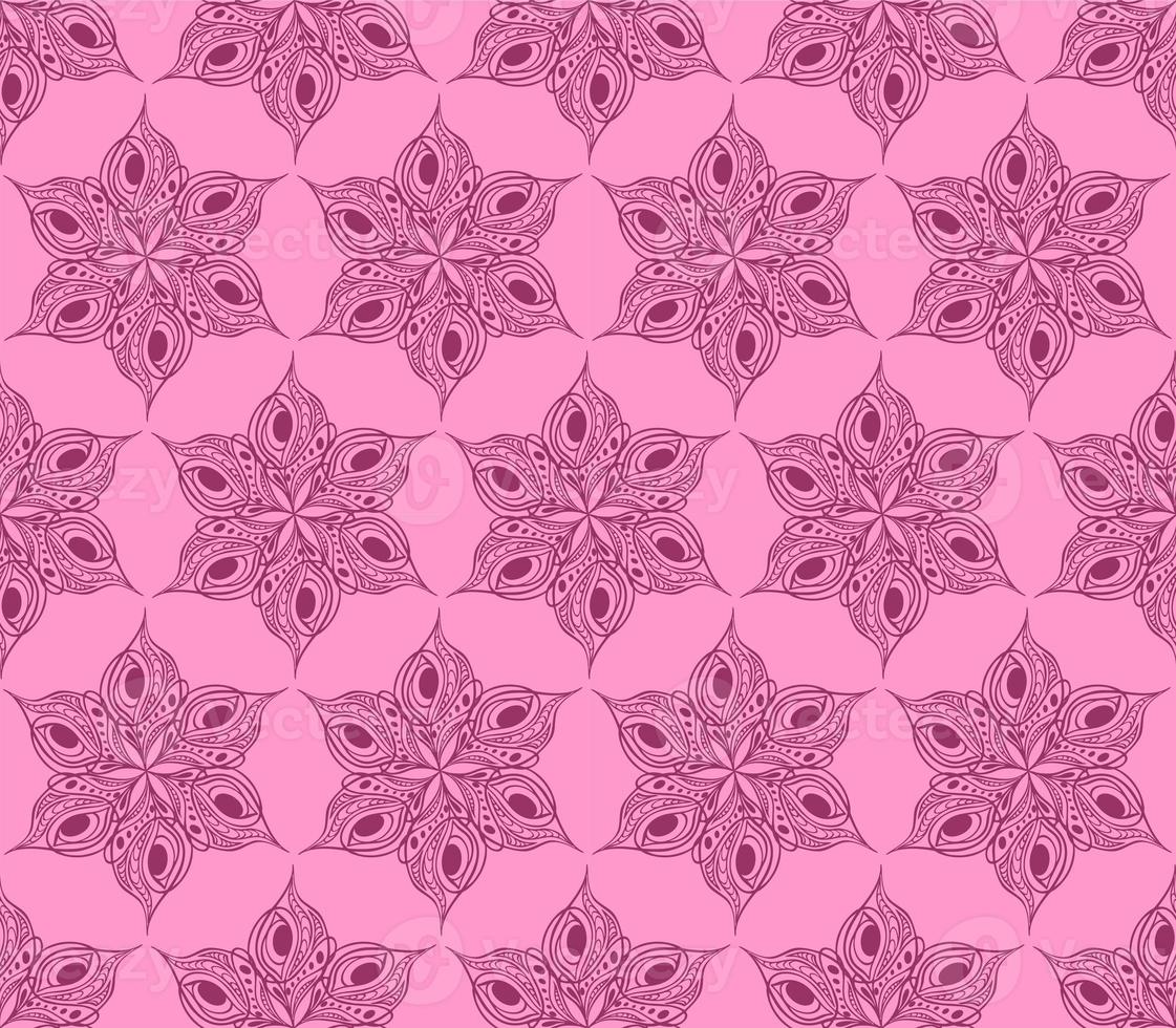 seamless symmetrical pattern of abstract magenta graphic elements on a pink background, texture, design photo