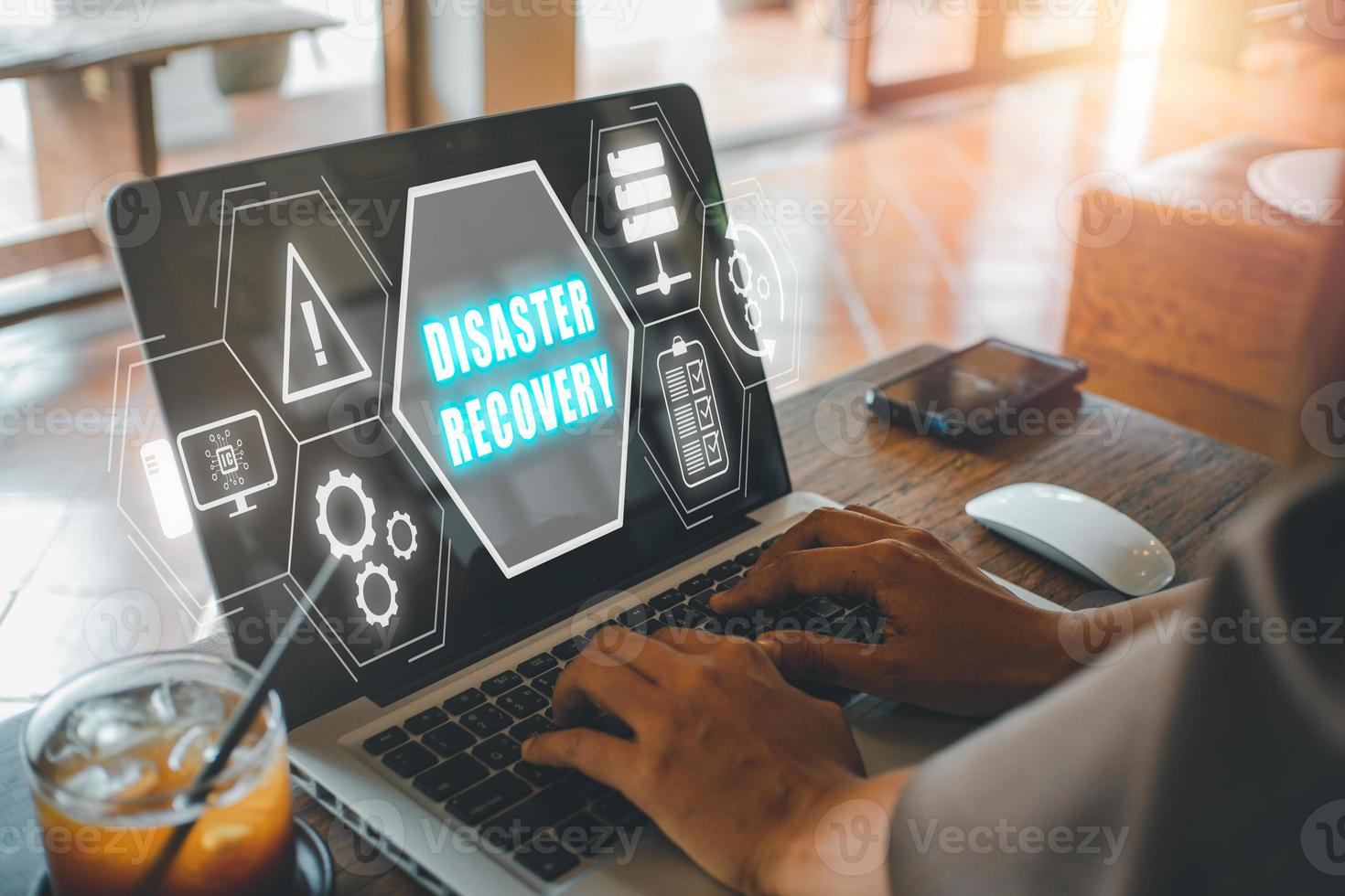 Disaster Recovery concept, Person hand using laptop computer with Disaster Recovery icon on virtual screen. photo
